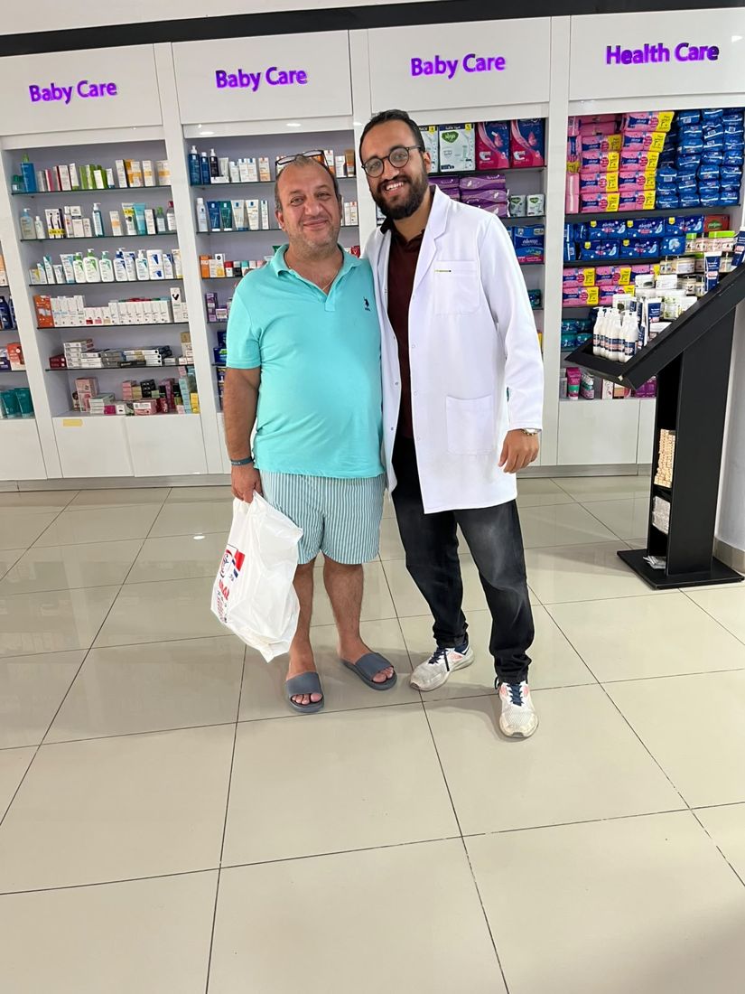 A guest with our pharmacist in the baby care aisle
